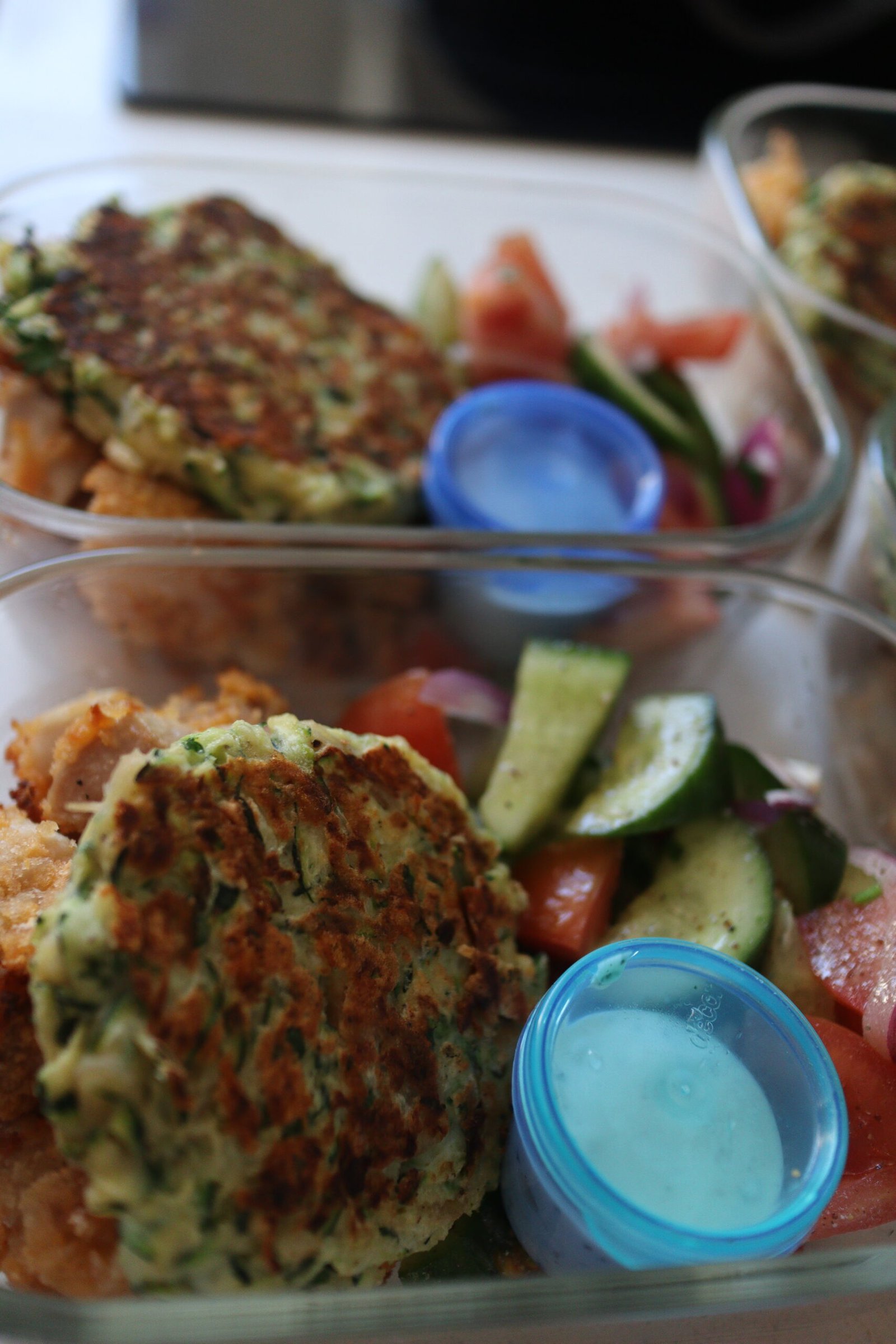 Zucchini fritter meal prep in tupperwares